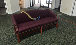 red upholstery couch being cleaned in southern indiana.