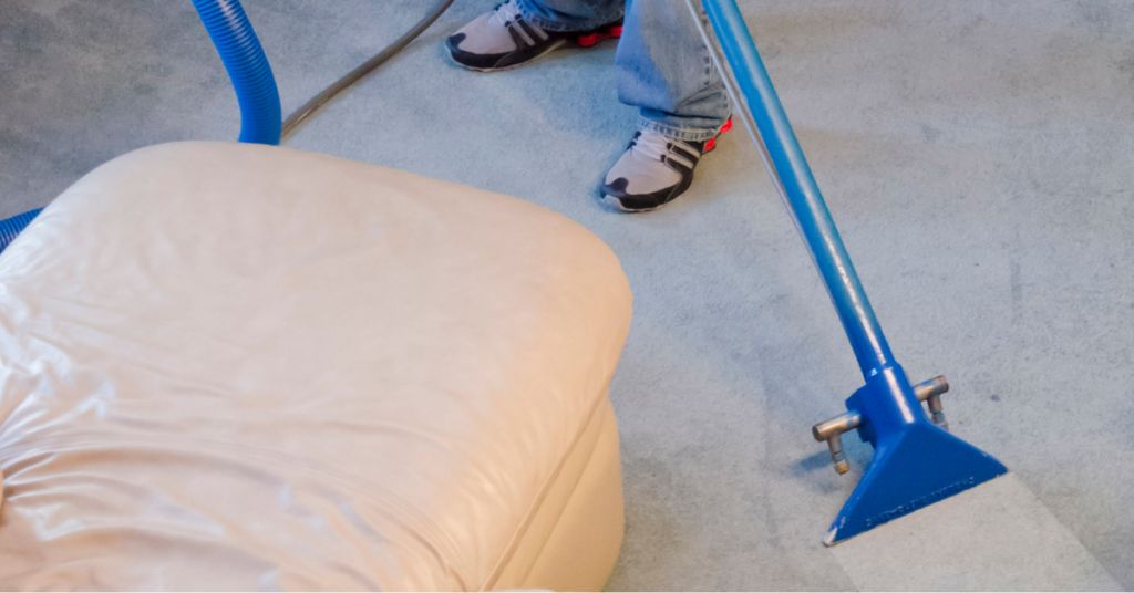 Windell's Carpet Care owner Aaron Windell uses the best carpet cleaning method, hot water extraction, to clean a gray carpet. An eco-friendly way to clean and remove odor from carpets.