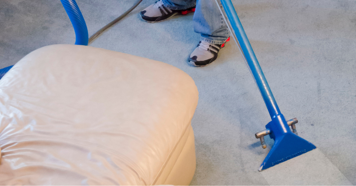 Windell's Carpet Care owner Aaron Windell uses the best carpet cleaning method, hot water extraction, to clean a gray carpet. An eco-friendly way to clean and remove odor from carpets.